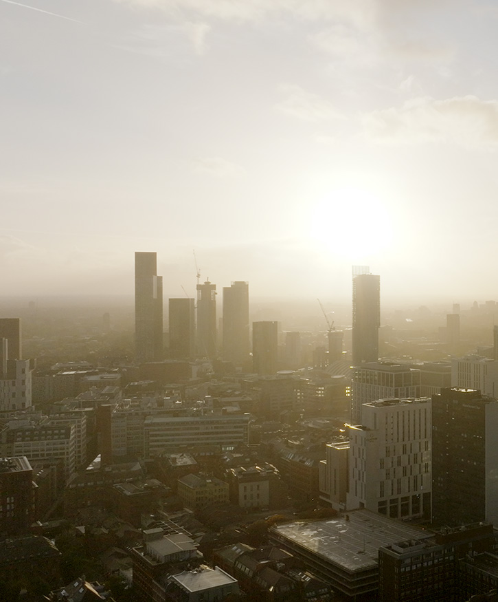 A drone photo of Manchester city centre during a sunset.